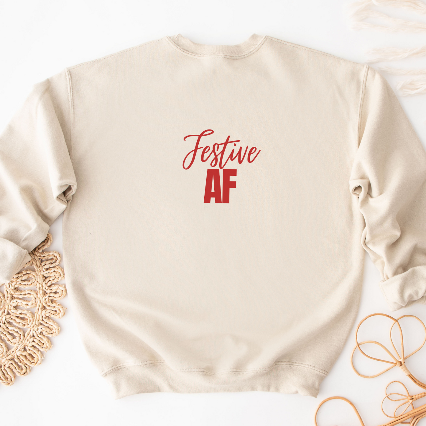 "Festive AF text design centered on a natural unisex sweater."