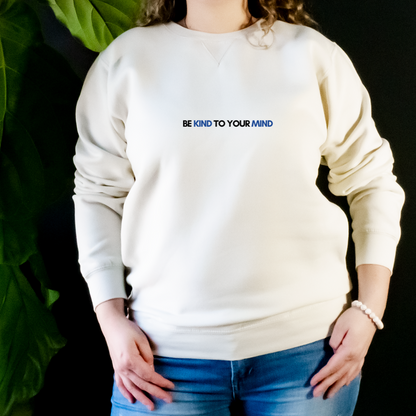 “Wearing this sweater can serve as a constant reminder to stay in tune with our mental health, practice self-care, and be kind to both ourselves and others. Join us in promoting good mental health practices with our "Be Kind to Your Mind" sweater.”
