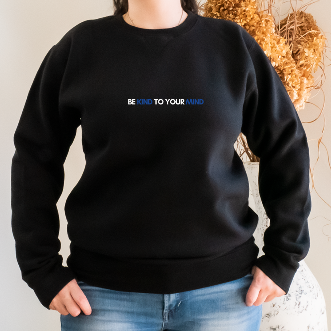 “Wearing this sweater can serve as a constant reminder to stay in tune with our mental health, practice self-care, and be kind to both ourselves and others. Join us in promoting good mental health practices with our "Be Kind to Your Mind" sweater.”