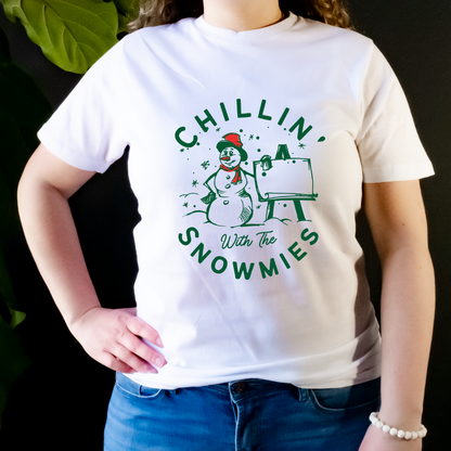 "Chillin' with the snowmies text design centered on white t-shirt."