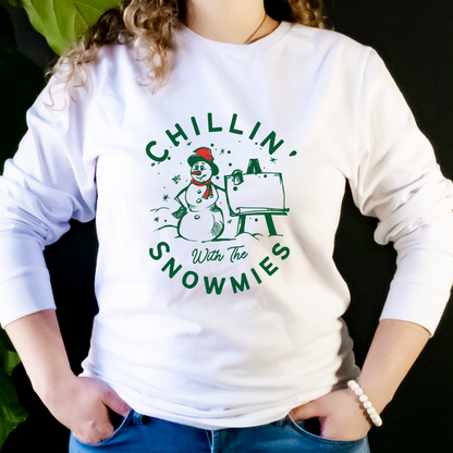 "Chillin' with the snowmies text design centered on white long sleeve shirt."