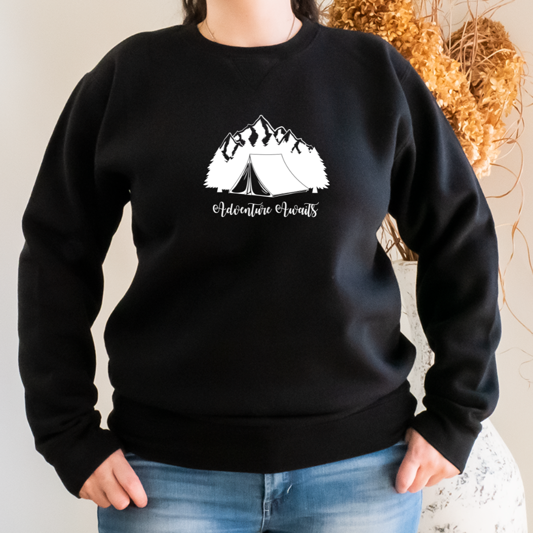"The Sweater features a design of a camping scene; a cozy tent sits in the middle of a forest, surrounded by trees and a mountain range in the distance. We want to capture the adventurous spirit and love for the great outdoors that camping lovers feel".