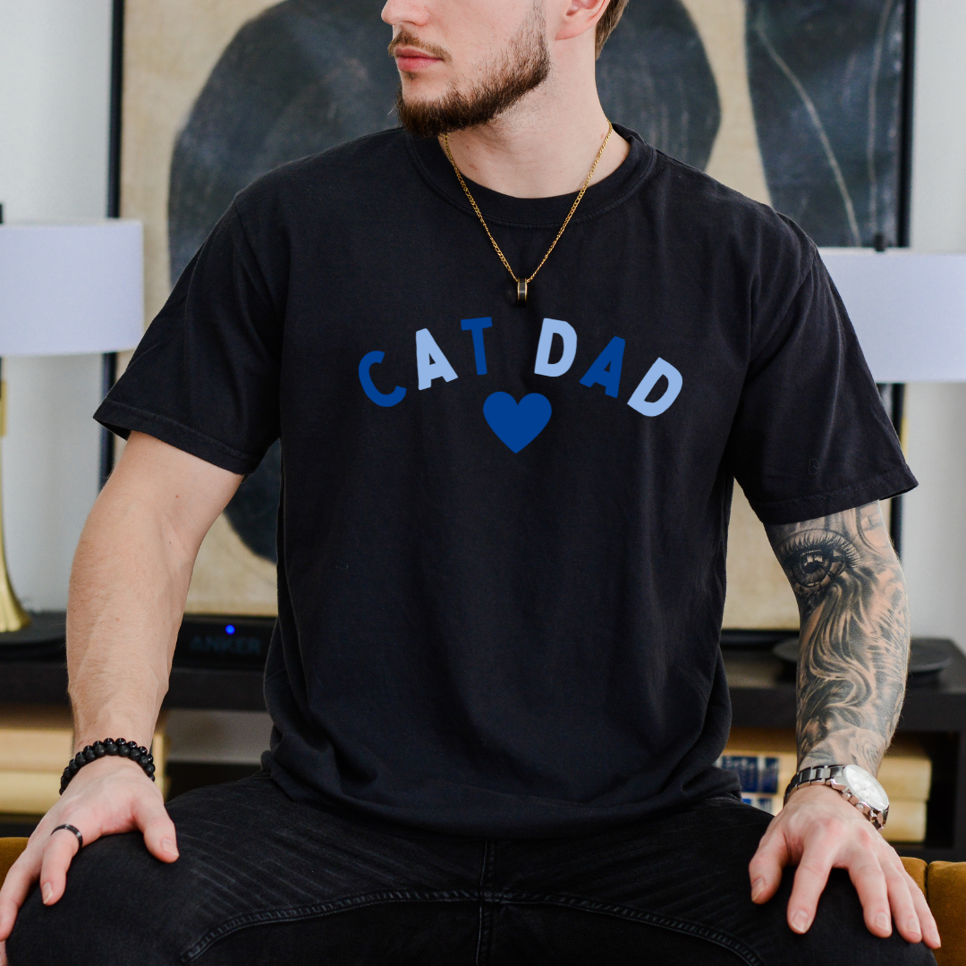 "Cat Dad Heart design centered on black t-shirt."