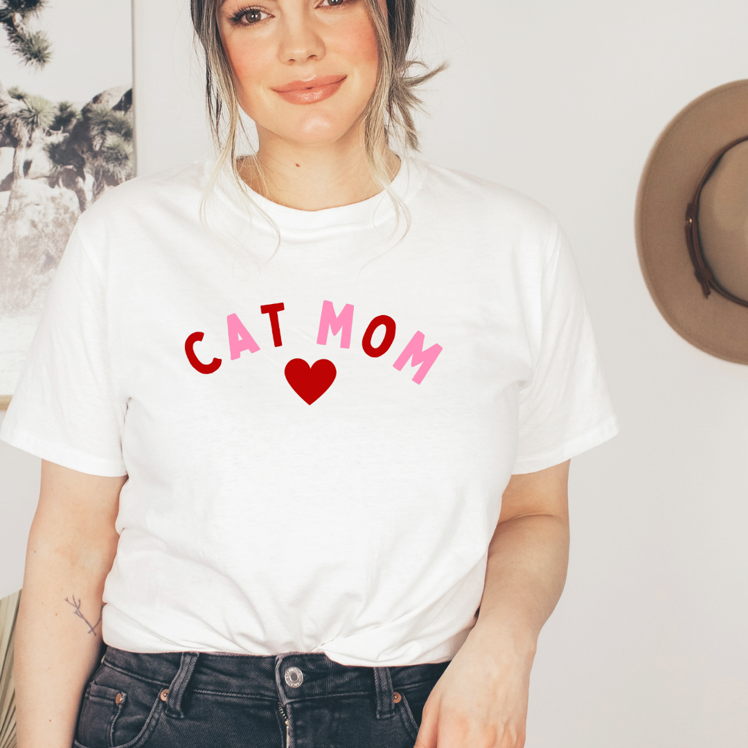 "Cat Mom Heart design centered on white t-shirt."