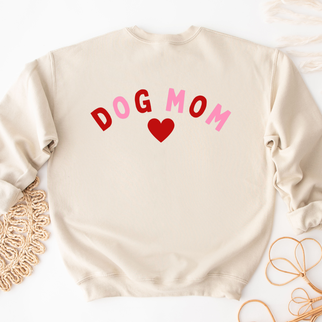 "Dog Mom Heart design centered on natural sweater."