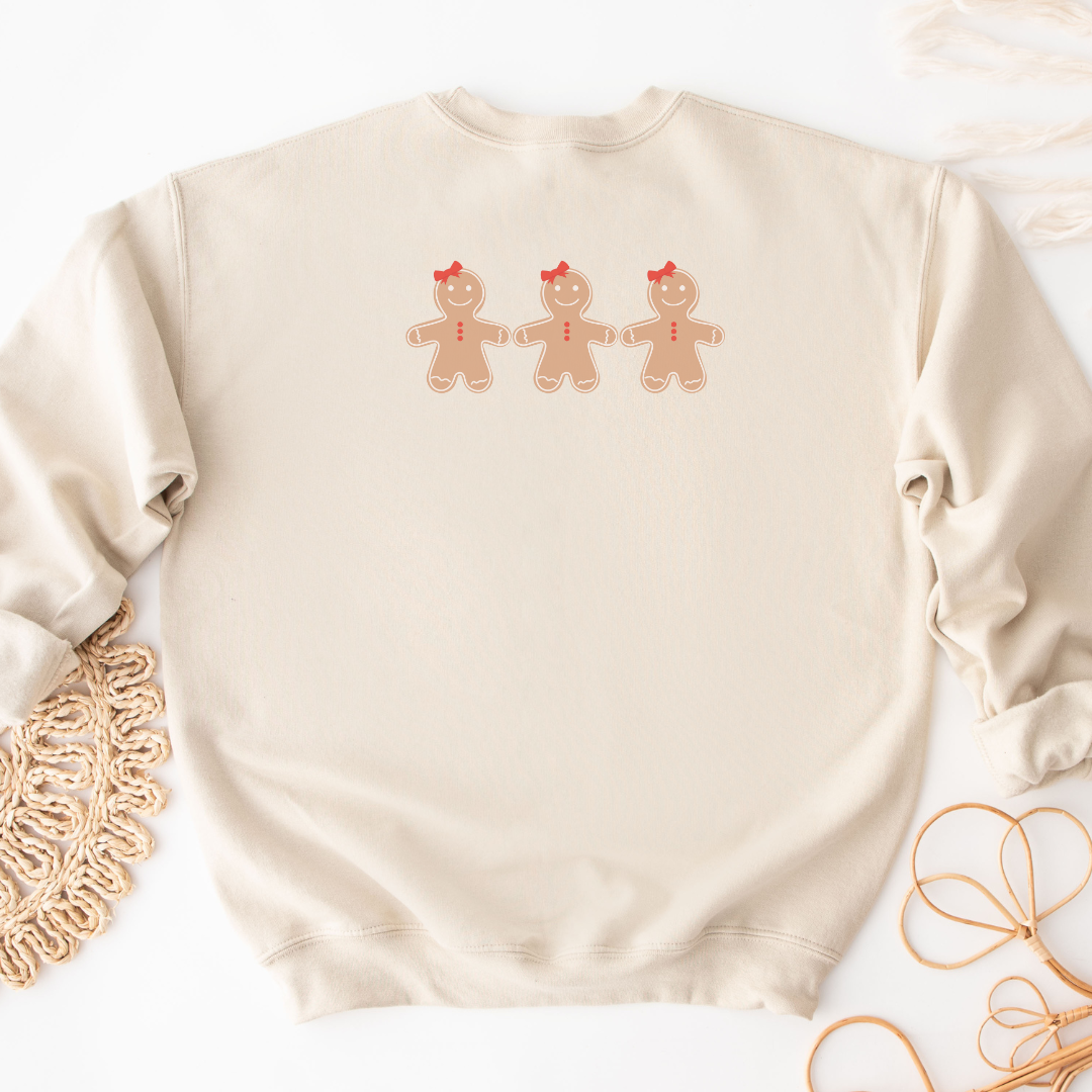 "Gingerbread cookies graphic design centered on natural sweater."
