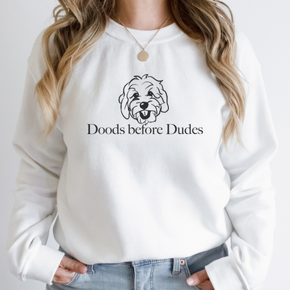 "Doods before dudes text and graphic design centered on white sweater."