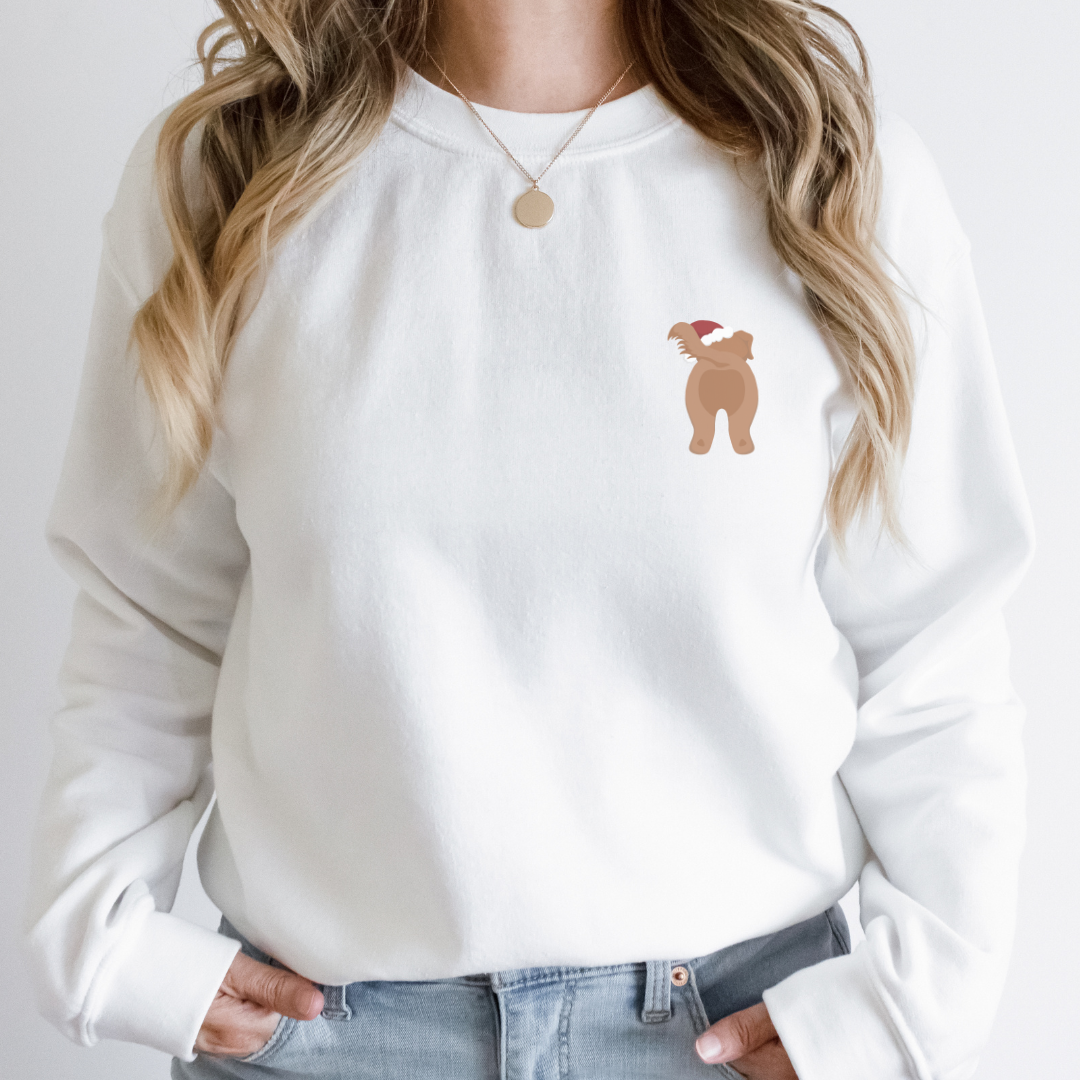"Christmas dog graphic left pocket position on white sweater."