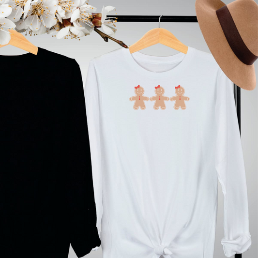 "Gingerbread cookies graphic design centered on white long sleeve shirt."