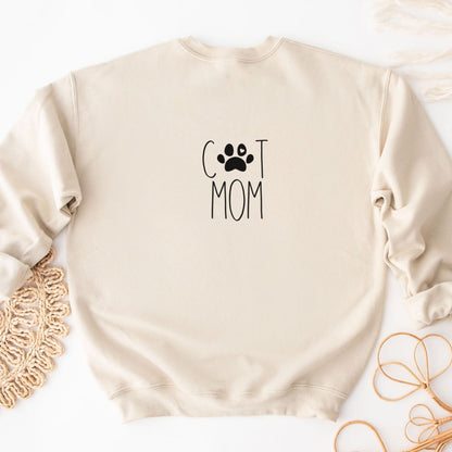 "Cat mom text design centered on natural sweater."
