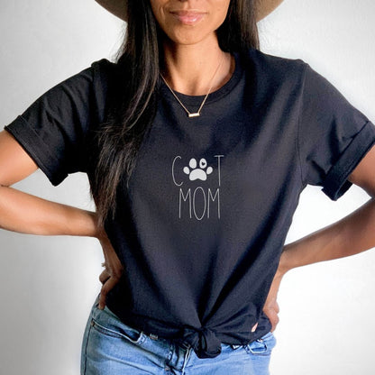 "Cat mom text design centered on black t-shirt."