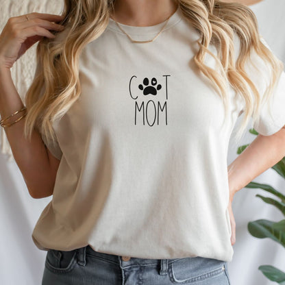 "Cat mom text design centered on natural t-shirt."
