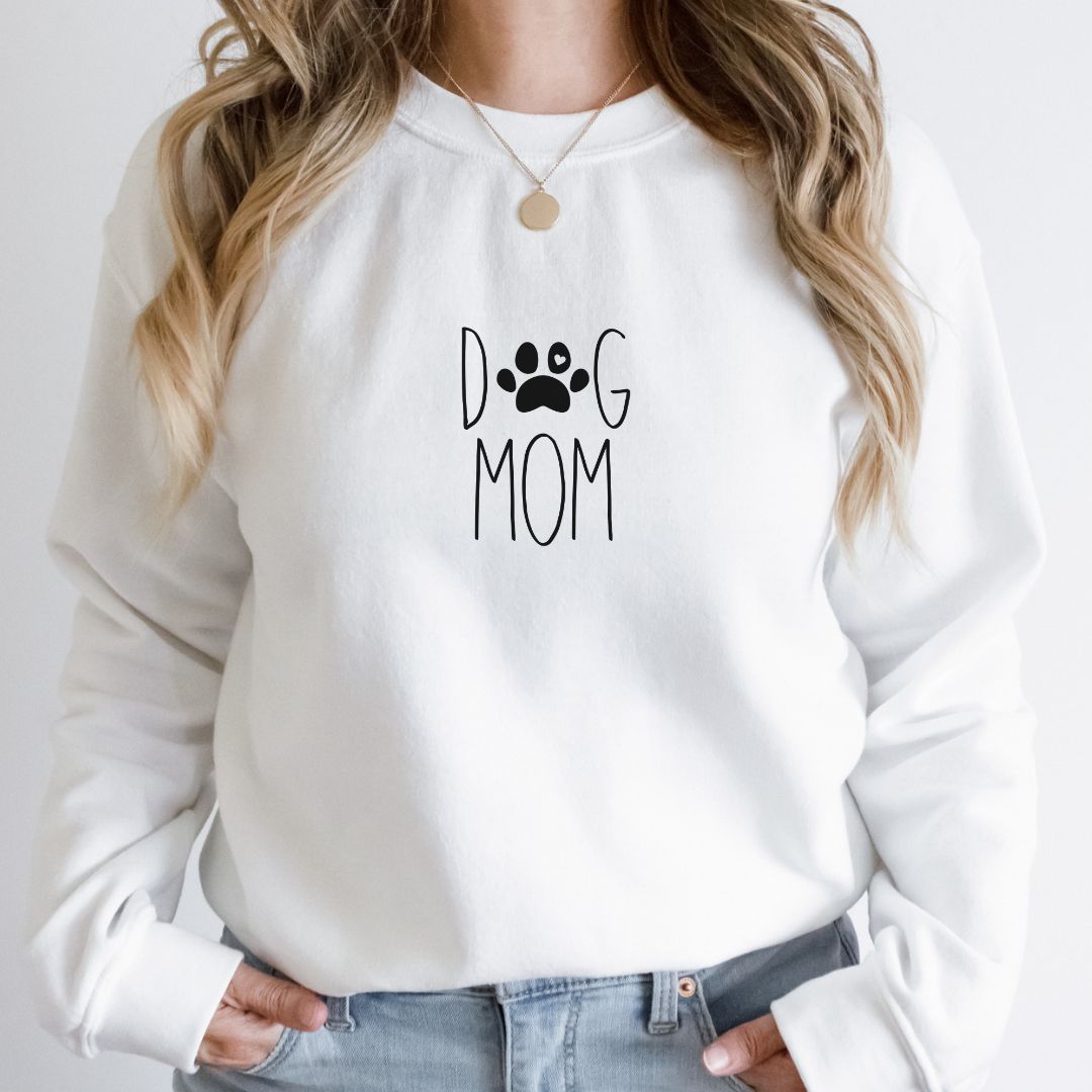 "Dog mom text design centered on white sweater."