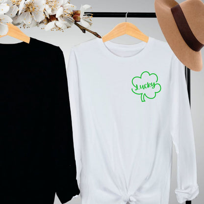 "Lucky Clover graphic design centered on white long sleeve shirt."