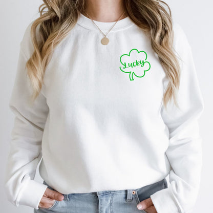 "Lucky Clover graphic design centered on white sweater."