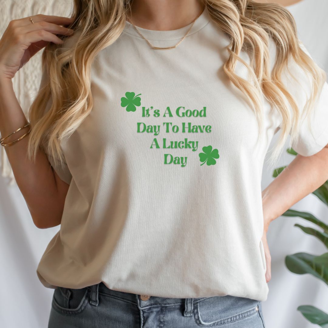"Lucky Day text design centered on natural t-shirt."