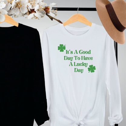 "Lucky Day text design centered on white long sleeve shirt."